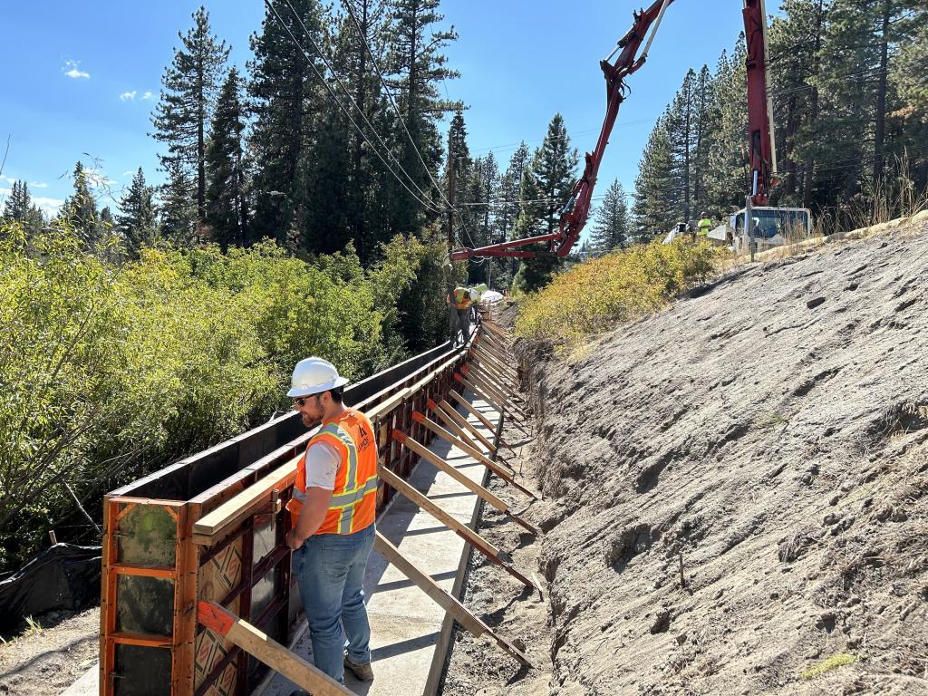 Construction workers build a retaining wall along the North Shore Trail.